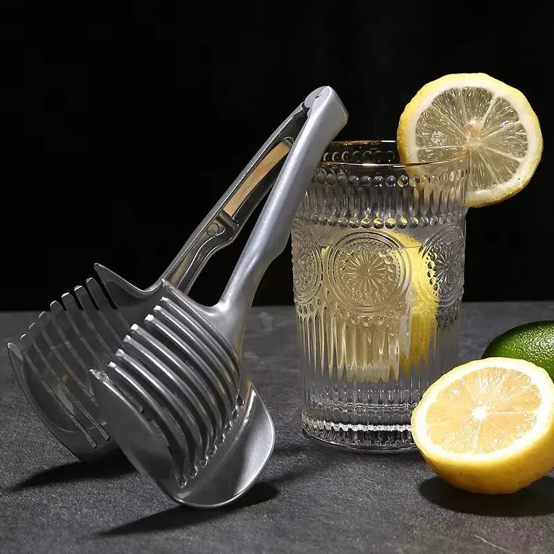 Slice like a pro! 🍊🍅 Upgrade your kitchen with this stainless steel handheld citrus and tomato slicer! #KitchenGadgets #CookingEssentials