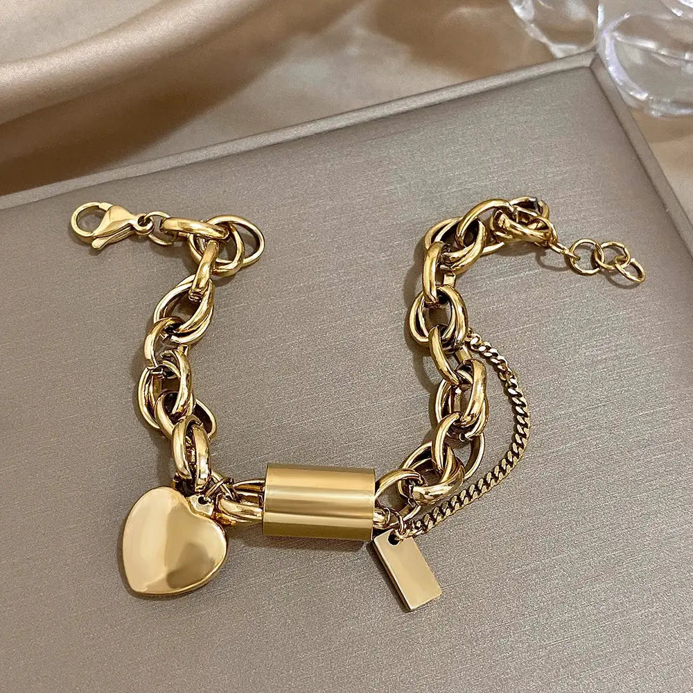 Add a Touch of Luxury with Our Exquisite DZ Fashion Design Gold Color Thick Chain Stainless Steel Bracelets NNOS